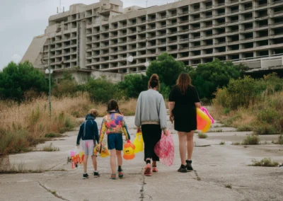 A family of four seen from behind